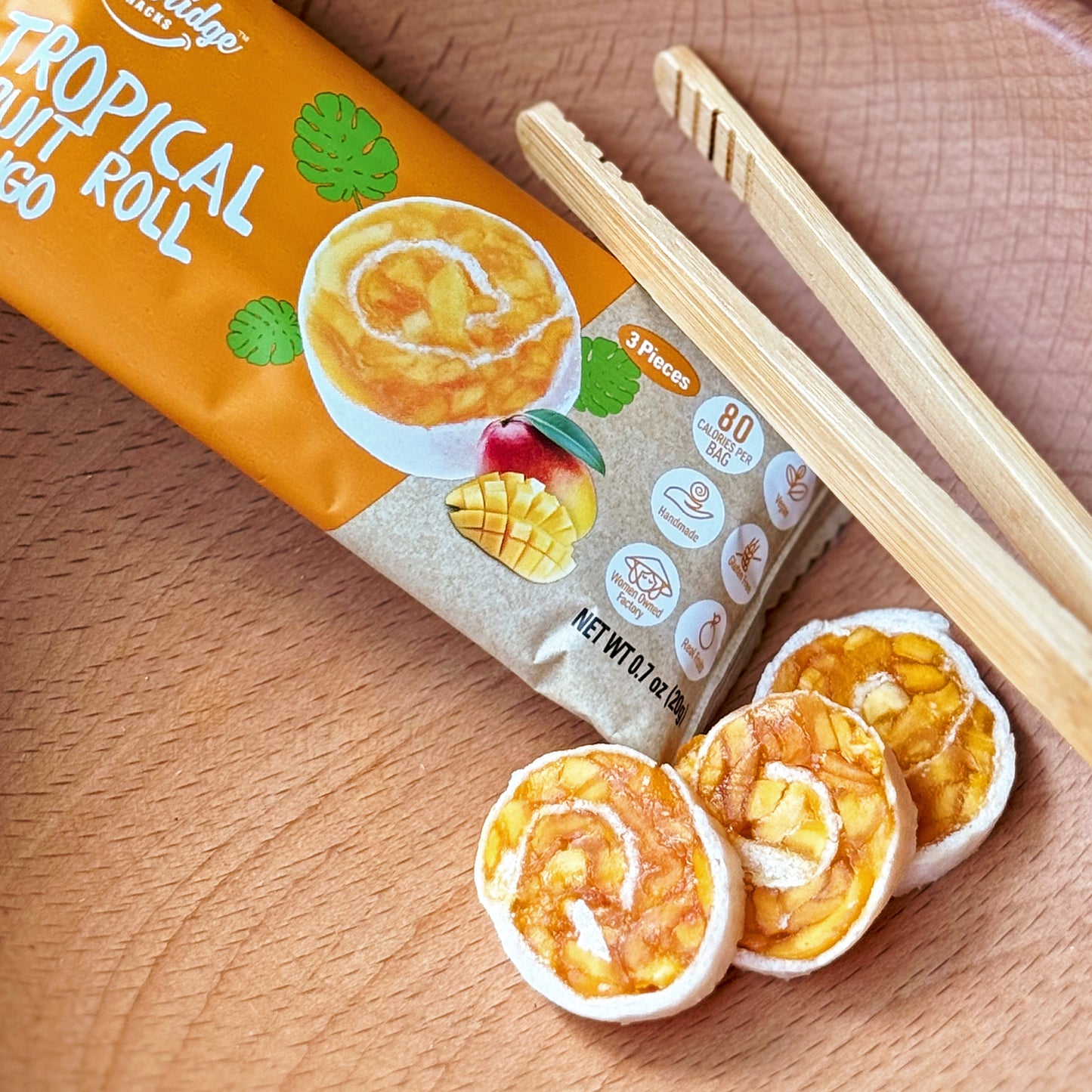 A close up of a mango fruit roll by Woodridge Snacks.